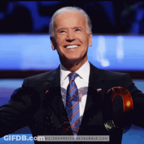 A Man In A Suit And Tie Is Smiling With The Website Mobilizeamerica.redbubble.com Behind Him GIF