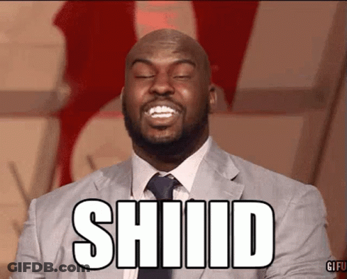 A Man In A Suit And Tie Is Smiling With The Word Shiid On His Face GIF