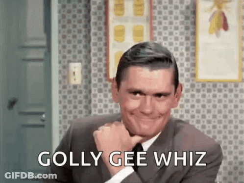 A Man In A Suit And Tie Is Smiling With The Words `` Golly Gee Whiz '' Written Next To Him . GIF