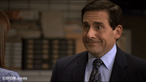 A Man In A Suit And Tie Is Smiling With The Words I 'M Joking Below Him GIF