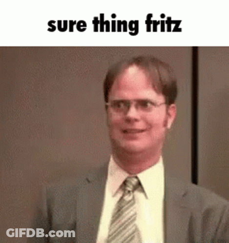 A Man In A Suit And Tie Is Smiling With The Words `` Sure Thing Fritz '' Written Above Him . GIF