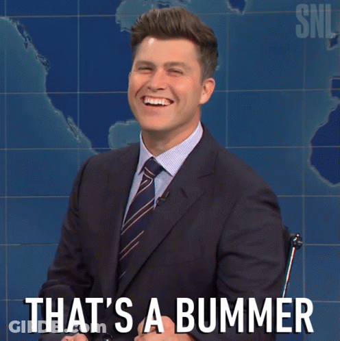 A Man In A Suit And Tie Is Smiling With The Words That 'S A Bummer Behind Him GIF