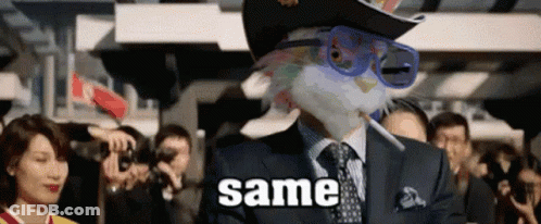 A Man In A Suit And Tie Is Smoking A Cigarette And Wearing A Hat And Sunglasses With The Word Same Written On It GIF