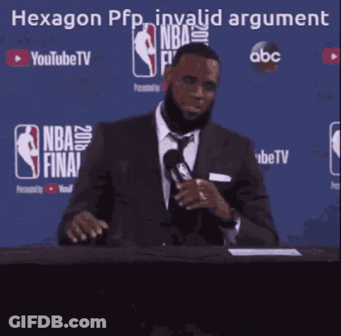 A Man In A Suit And Tie Is Speaking Into A Microphone In Front Of A Blue Background That Says Nba Finals GIF