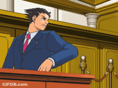 A Man In A Suit And Tie Is Standing At A Podium GIF