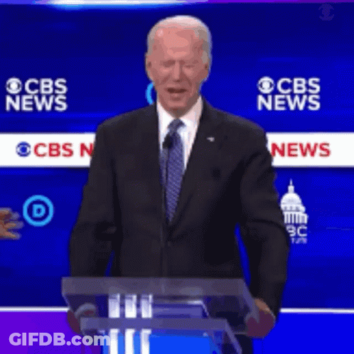 Man In Suit At Podium With CBS News GIF