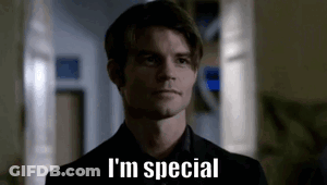 A Man In A Suit And Tie Is Standing In A Hallway And Saying `` I 'M Special '' . GIF