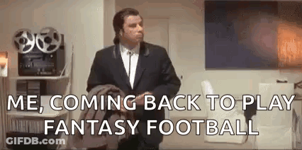 A Man In A Suit And Tie Is Standing In A Living Room And Says `` Me , Coming Back To Play Fantasy Football `` . GIF