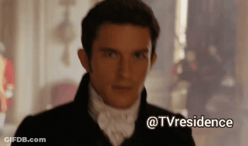 A Man In A Suit And Tie Is Standing In A Room With A Caption That Says Tvresidence GIF