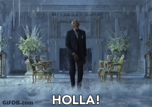 A Man In A Suit And Tie Is Standing In A Room With Holla Written On The Floor GIF