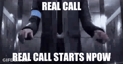 A Man In A Suit And Tie Is Standing In An Elevator With His Arms Outstretched And The Words `` Real Call '' . GIF