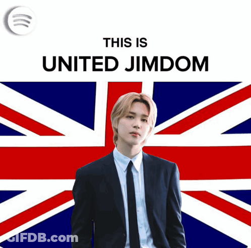 A Man In A Suit And Tie Is Standing In Front Of A British Flag With The Words " This Is United Jimdom " Above Him GIF
