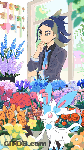 Man In Suit And Tie In Front Of Flowers GIF
