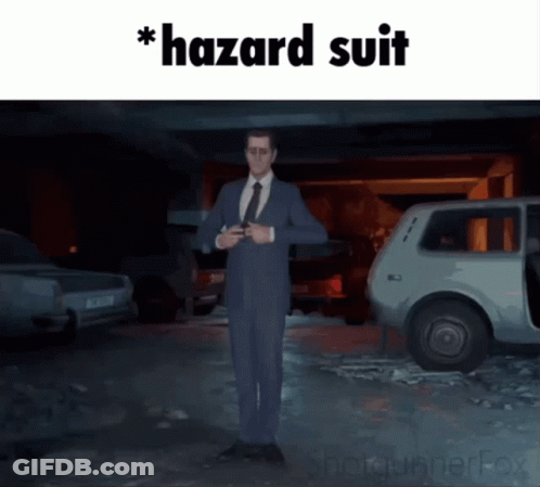 A Man In A Suit And Tie Is Standing In Front Of A Car With The Words Hazard Suit Written On The Bottom GIF