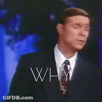 A Man In A Suit And Tie Is Standing In Front Of A Cross With The Words Why Written Above Him GIF