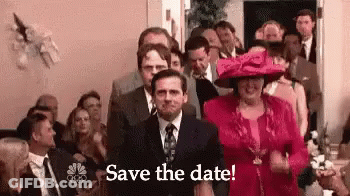 A Man In A Suit And Tie Is Standing In Front Of A Crowd Of People With The Words `` Save The Date '' . GIF