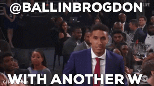 A Man In A Suit And Tie Is Standing In Front Of A Crowd With Another W Written On The Bottom GIF