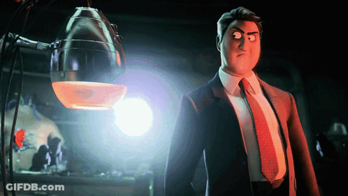 A Man In A Suit And Tie Is Standing In Front Of A Light GIF