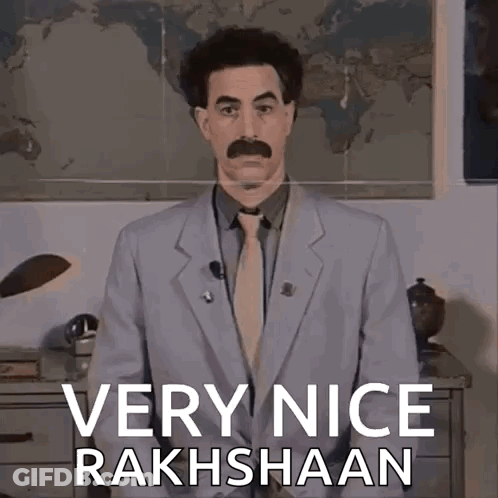 A Man In A Suit And Tie Is Standing In Front Of A Map And Says Very Nice Rakhshaan GIF