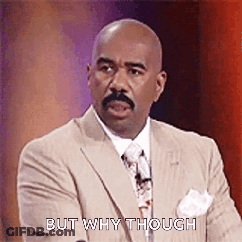 A Man In A Suit And Tie Is Standing In Front Of A Microphone And Saying `` But Why Though '' . GIF