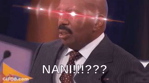 A Man In A Suit And Tie Is Standing In Front Of A Microphone With Red Lights Coming Out Of His Eyes And Says Nan ! GIF