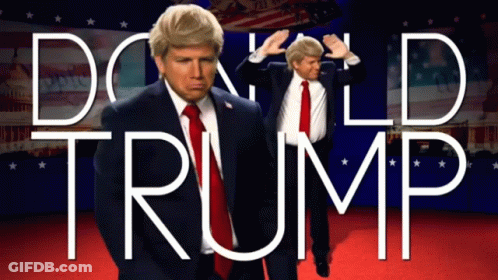 A Man In A Suit And Tie Is Standing In Front Of A Sign That Says Donald Trump GIF