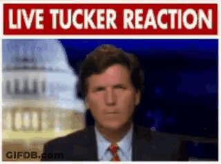 A Man In A Suit And Tie Is Standing In Front Of A Sign That Says " Live Tucker Reaction " GIF