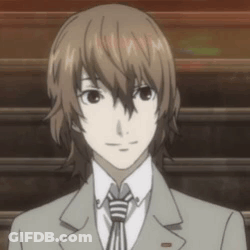 Man In Suit And Tie Standing In Front Of Staircase GIF