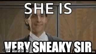 A Man In A Suit And Tie Is Standing In Front Of A Wall And Says `` She Is Very Sneaky Sir '' . GIF