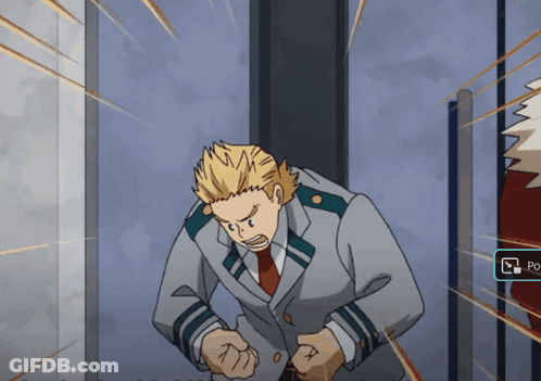 A Man In A Suit And Tie Is Standing In Front Of A Wall With A Po Button GIF