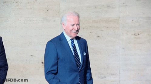 Man In Suit And Tie Fist Raised GIF