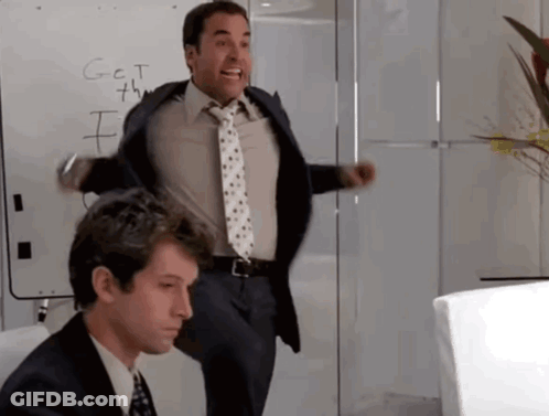 A Man In A Suit And Tie Is Standing In Front Of A White Board That Says G = C = T GIF