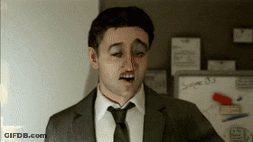 A Man In A Suit And Tie Is Standing In Front Of A Whiteboard That Says Sage 83 GIF