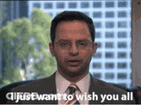 A Man In A Suit And Tie Is Standing In Front Of A Window And Saying `` I Just Want To Wish You All '' . GIF