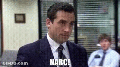 A Man In A Suit And Tie Is Standing In Front Of A Window In An Office . GIF