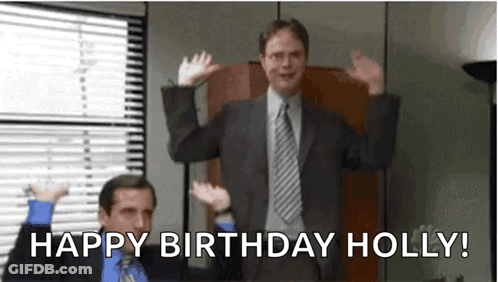 A Man In A Suit And Tie Is Standing In Front Of A Window With His Hands In The Air . GIF