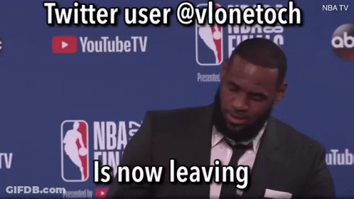 A Man In A Suit And Tie Is Standing In Front Of A Youtube Tv Banner GIF