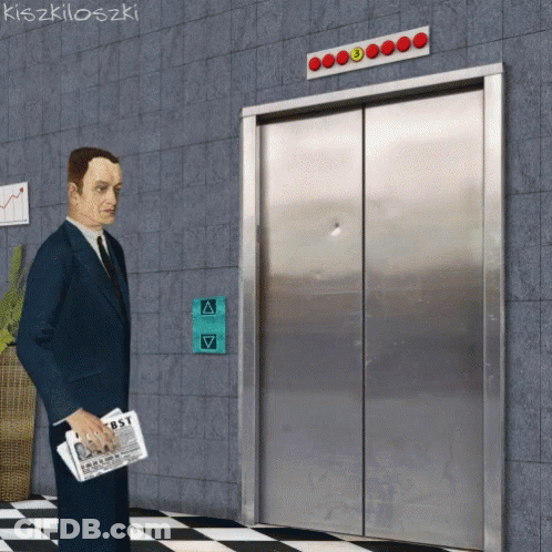 A Man In A Suit And Tie Is Standing In Front Of An Elevator With A Sign That Says First On It GIF