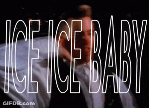 A Man In A Suit And Tie Is Standing In Front Of The Words Ice Ice Baby GIF