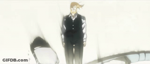 A Man In A Suit And Tie Is Standing In The Middle Of A Broken Wall GIF