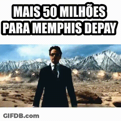 A Man In A Suit And Tie Is Standing In The Middle Of A Desert . GIF