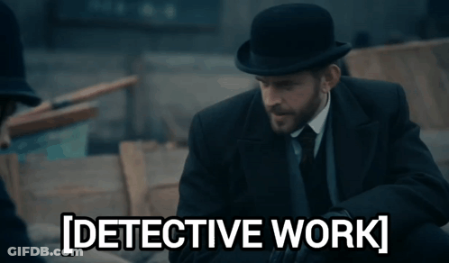 A Man In A Suit And Tie Is Standing Next To A Sign That Says Detective Work GIF