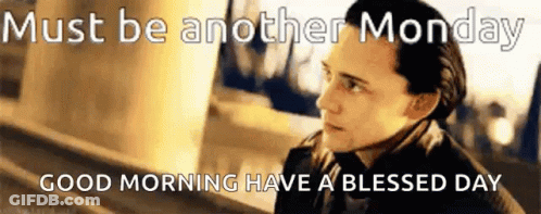 A Man In A Suit And Tie Is Standing Next To A Sign That Says Must Be Another Monday GIF