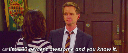 A Man In A Suit And Tie Is Standing Next To A Woman In A Striped Shirt And Talking To Her . GIF