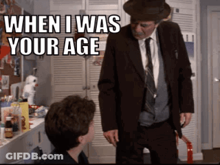 A Man In A Suit And Tie Is Standing Next To A Young Boy And Says When I Was Your Age GIF