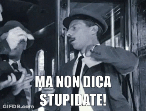 A Man In A Suit And Tie Is Standing Next To Another Man And Says Ma Non Dica Stupidate ! GIF