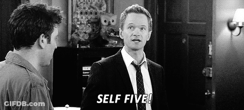 A Man In A Suit And Tie Is Standing Next To Another Man In A Room And Says `` Self Five '' . GIF