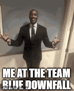 A Man In A Suit And Tie Is Standing With His Arms Outstretched And Says `` Me At The Team Blue Downfall '' GIF