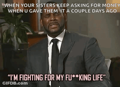 A Man In A Suit And Tie Is Talking About Fighting For Money . GIF