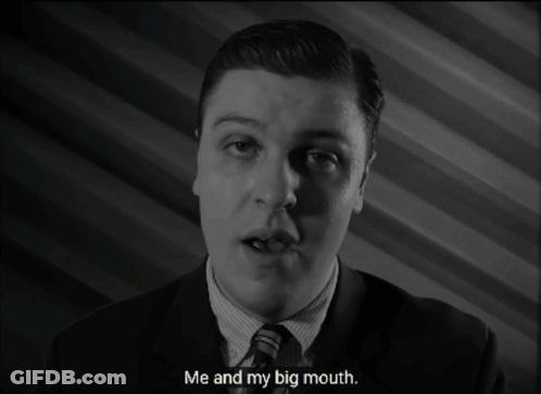 A Man In A Suit And Tie Is Talking About His Big Mouth GIF